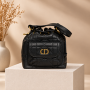 C111 handbag on warm beige studio pedestal